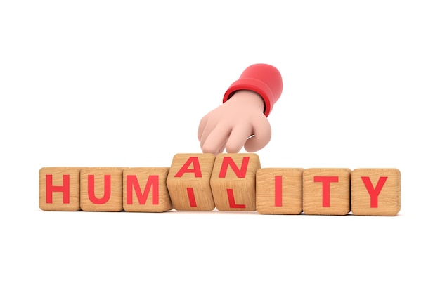 Hand turns dice and changes the word humanity to humility