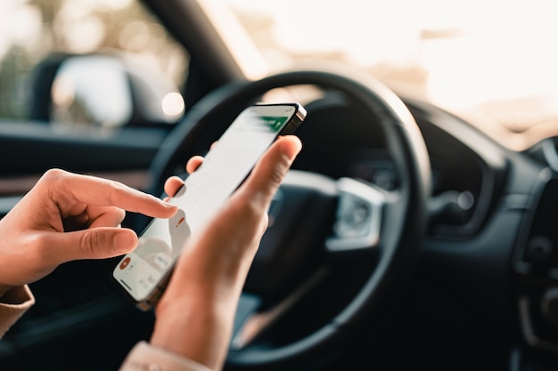 Hand using GPS navigation system in car while travel