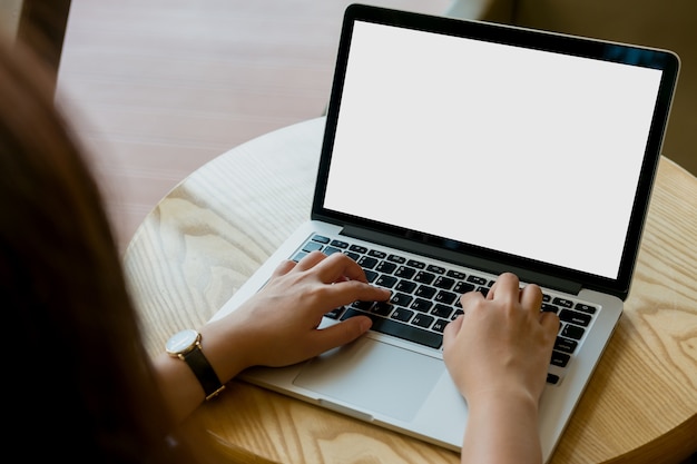 Hand using mockup computer laptop