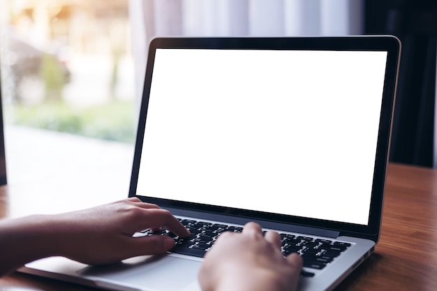 Hand using mockup computer laptop