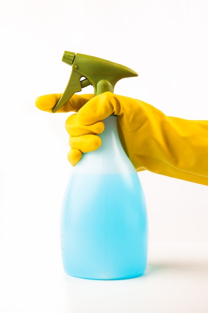 Hand using spray bottle