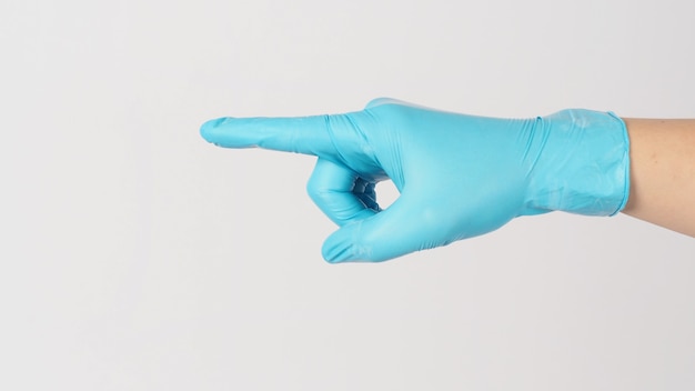 Hand wear medical glove and point or touch gestureing on white background.