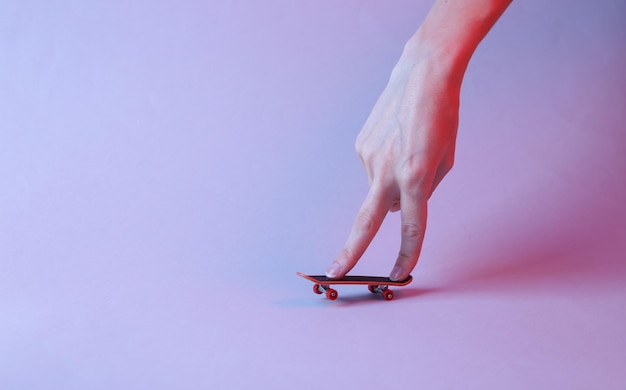 Hand with finger board in red blue neon light