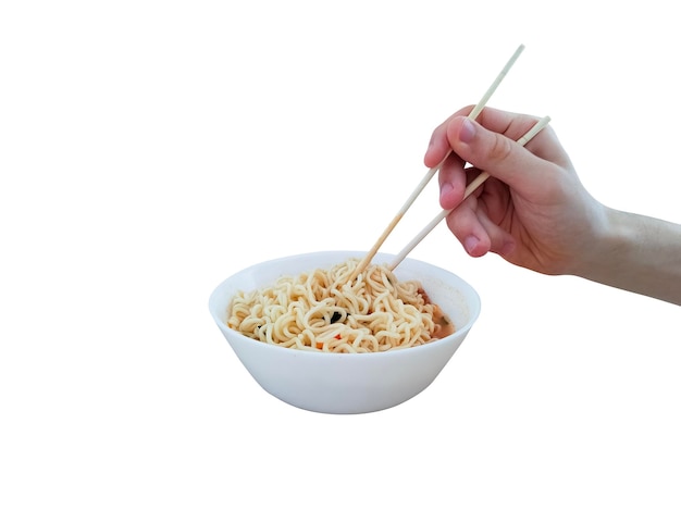 Hand with food sticks for instant noodles in the plate isolated on white background