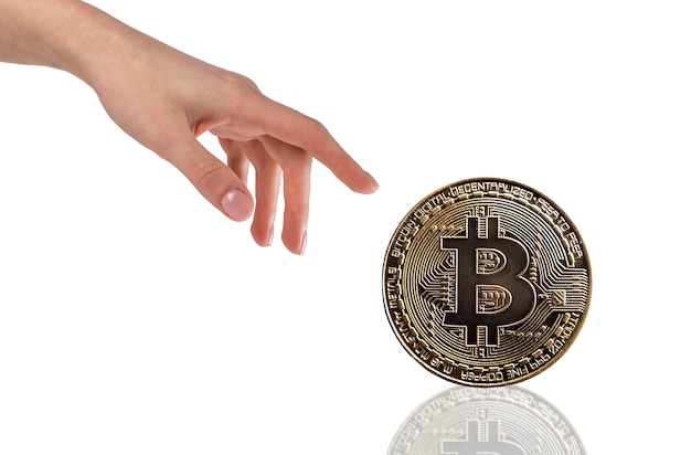 Hand with golden bitcoin coin isolated on white background Cryptocurrency digital money concept Blockchain technology