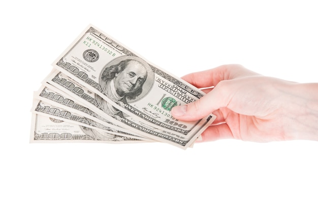 Hand with money isolated on white background