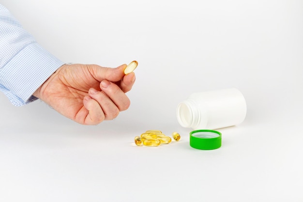 Hand with a tablet on a table on a white background