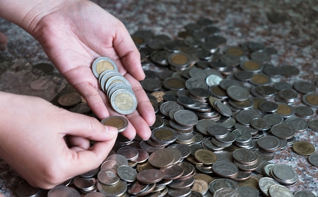 Hand women putting count money