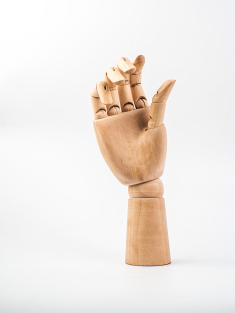 Hand of wood doll on white bakground