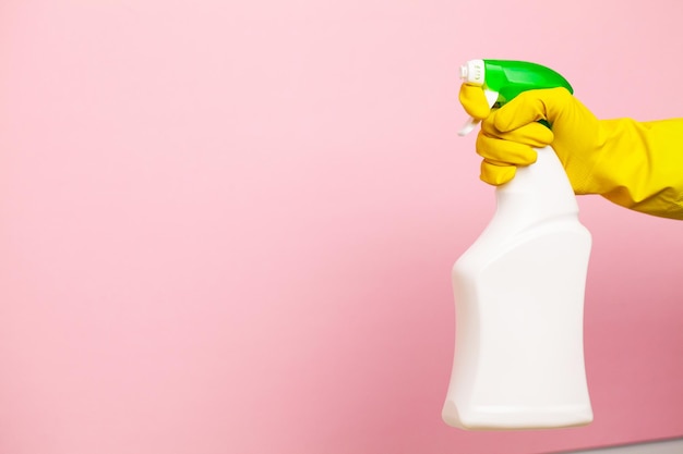 Hand in a yellow glove for cleaning.