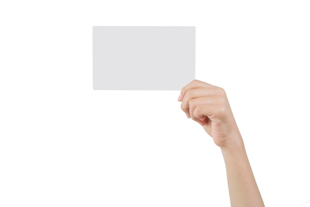 Hand of a young woman holding a white cardboard to mount an image or advertising text with a white background