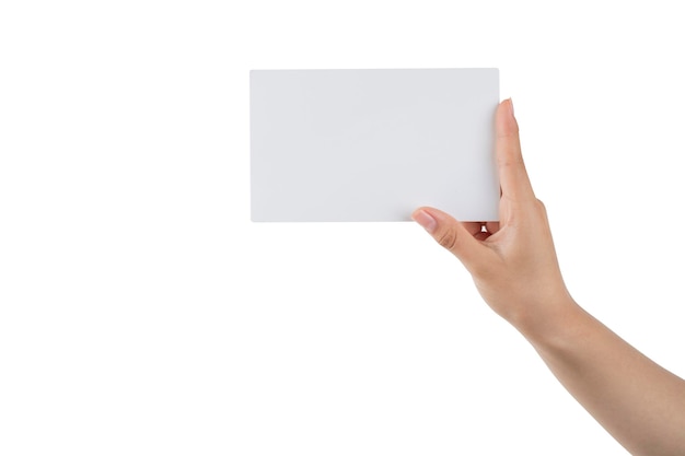 Hand of a young woman holding a white cardboard to mount an image or advertising text with a white background