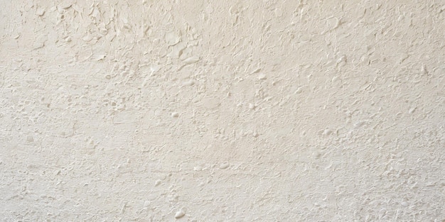 A handapplied stroke scraped white mortar or stucco wall background