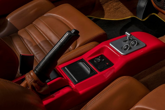 Handbrake of a luxury sports car finished in red and leather