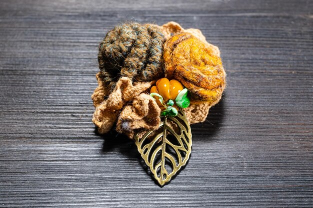 Handcrafted brooch with felt rose flowers close up