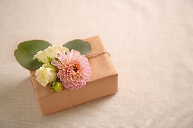 Handcrafted gift box with flowers on table