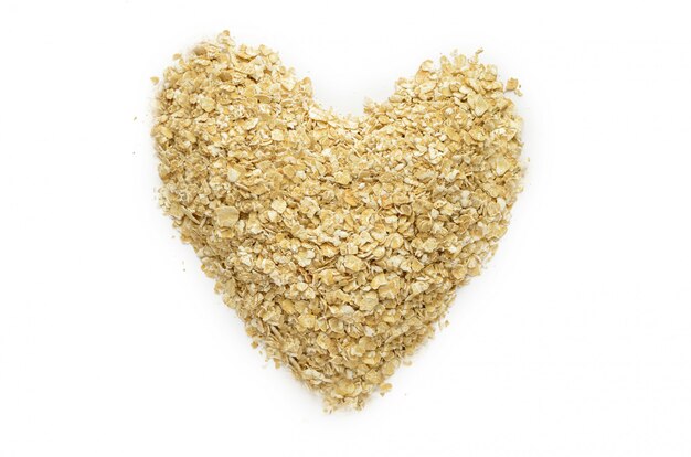 Handful of dry oatmeal in the form of heart