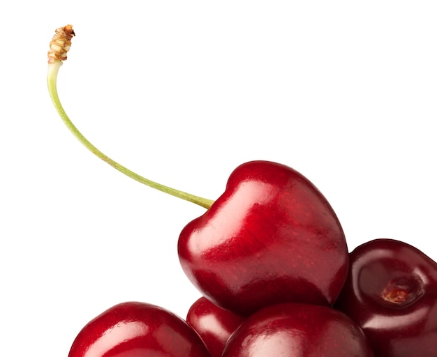 Handful of a red cherry over white background