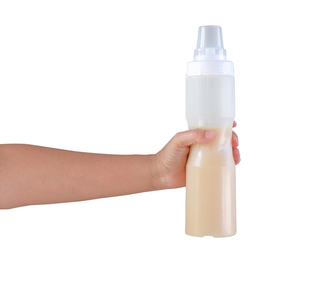 Handing holding milk bottle on white