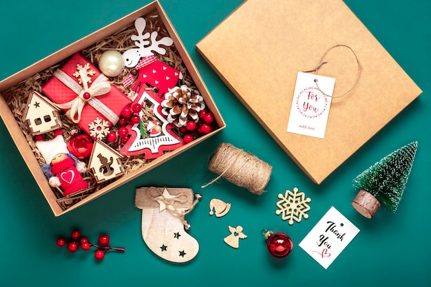 Handmade care package seasonal gift box with toys xmas decor on table