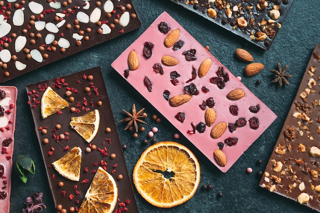 Handmade chocolate bars with a variety of dried fruit and nut toppings.