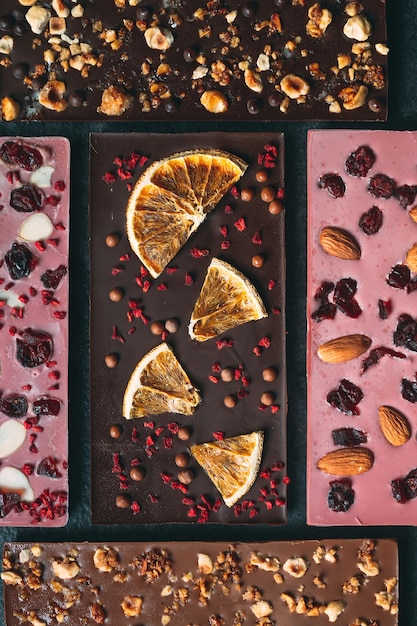 Handmade chocolate bars with a variety of dried fruit and nut toppings.