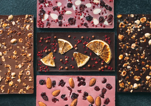 Handmade chocolate bars with a variety of dried fruit and nut toppings.