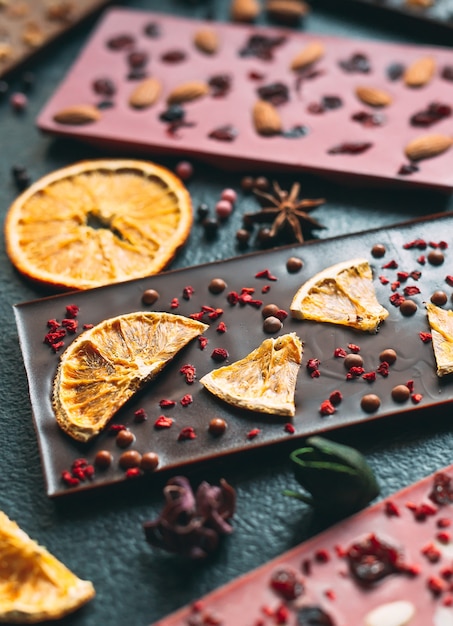 Handmade chocolate bars with a variety of dried fruit and nut toppings.