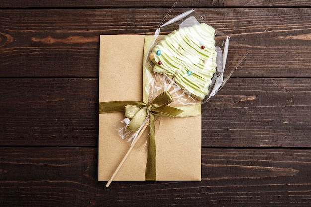 Handmade craft gift with candy on the wooden table