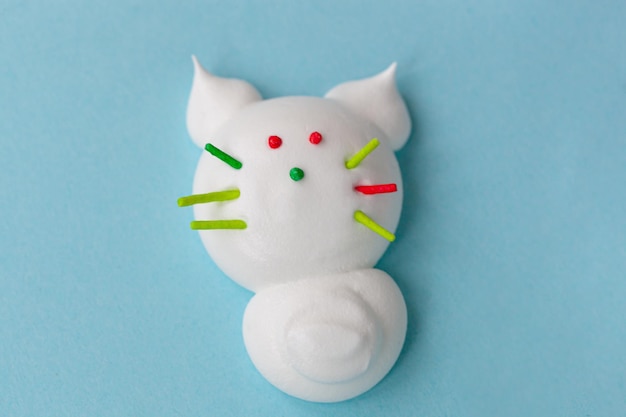 Handmade delicious single meringue in the form of funny cat