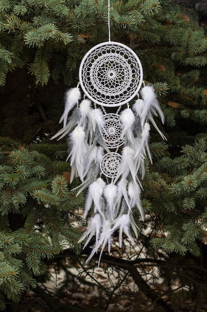 Handmade dream catcher with feathers threads and beads rope hanging