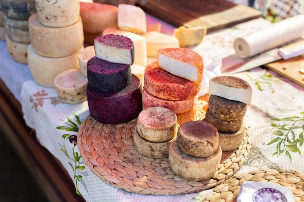 Handmade farm cheese on the counter of the market fair