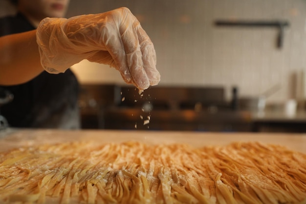 handmade fresh pasta making process. close up