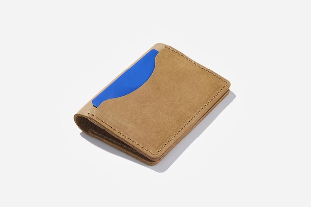 Handmade genuine leather case for credit cards on a white isolated background.