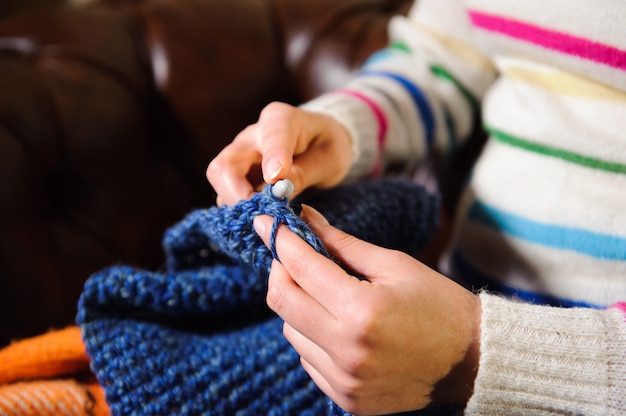 Photo handmade knitting, leisure woman activity. detail photo