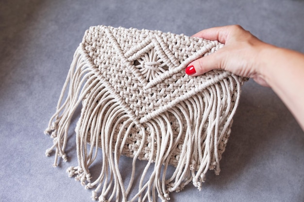 Handmade macrame cotton srossbody bag Eco bag for women from cotton rope Scandinavian style bag Bejge tones sustainable fashion accessories Details Close up image