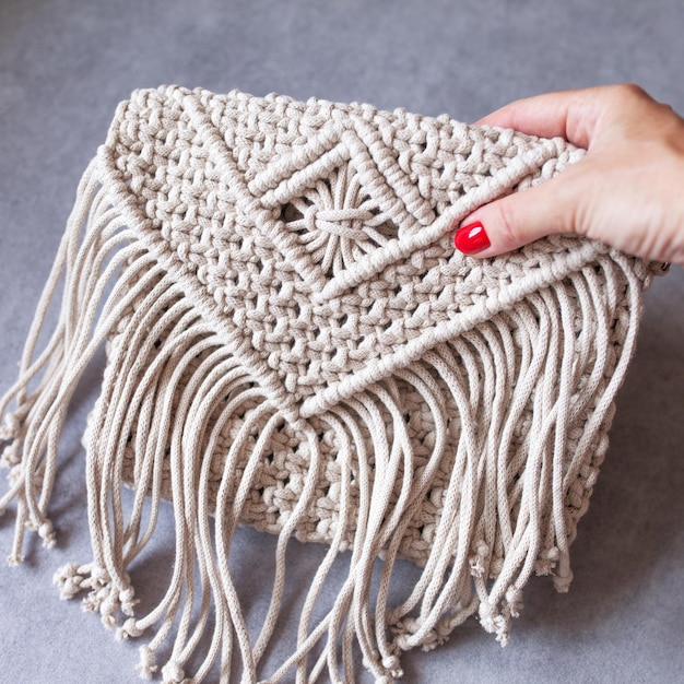 Handmade macrame cotton srossbody bag Eco bag for women from cotton rope Scandinavian style bag Bejge tones sustainable fashion accessories Details Close up image