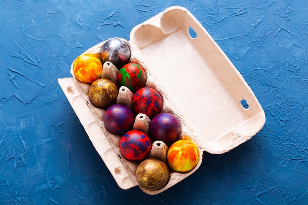 Handmade painted Easter eggs in egg box