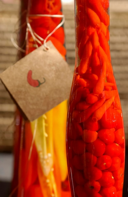 Handmade pepper in glass bottles for sale at a popular fair in Brazil