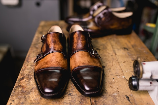 Handmade shoes in shoemaker's workshop.