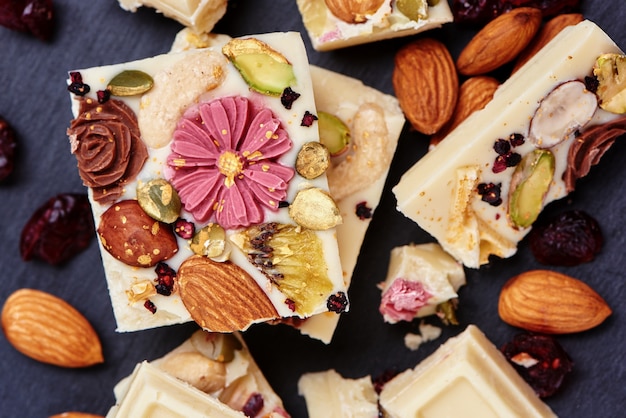 Handmade white chocolate with dried fruits and nuts