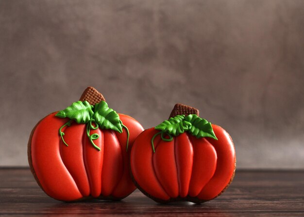 Handpainted gingerbread in the form of a pumpkin on a dark background