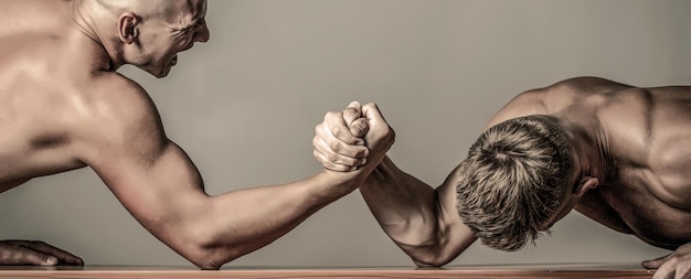 Hands or arms of man Arm wrestling Two men arm wrestling Rivalry closeup of male arm wrestling