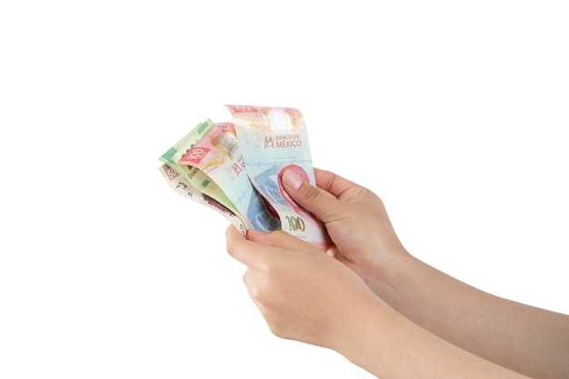 Hands counting Mexican pesos bills of different denominations with white background and copy space