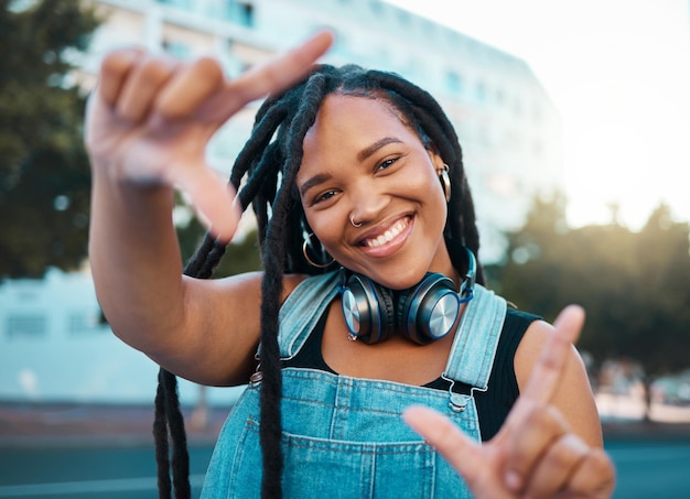 Hands frame city portrait and black woman with headphones for music during travel holiday in Italy Happy and young African girl with perspective inspiration and vision on fun vacation in summer