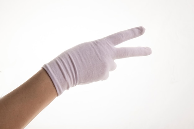 Hands gesticulating in white textile gloves on a white background