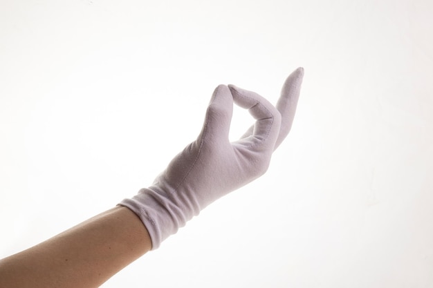 Hands gesticulating in white textile gloves on a white background