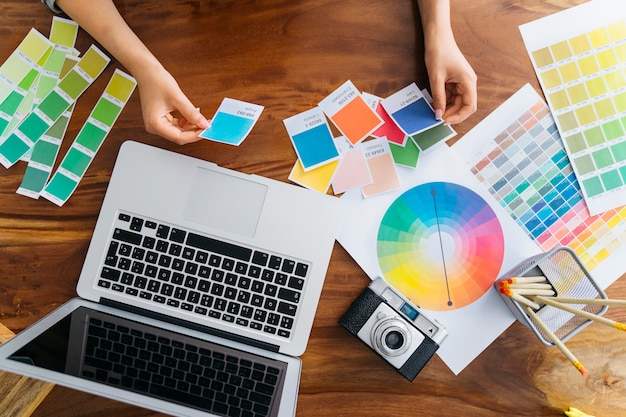 Hands of graphic designer working at desk