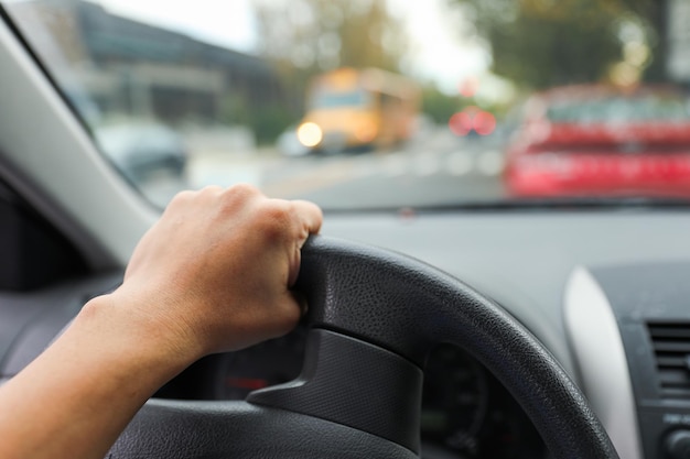 hands gripping a steering wheel symbolizing control focus and safety while driving