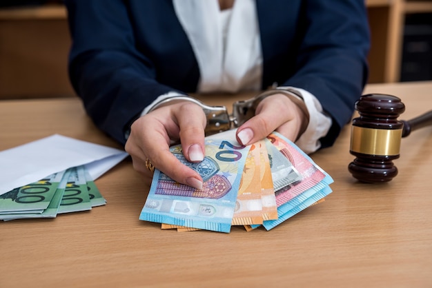 Hands In handcuffs arrested for bribe with euro bills